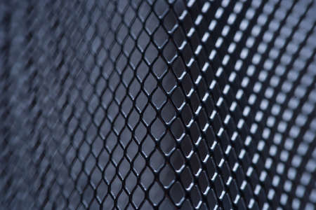 macro gray metallic grid with lighting effects. background monochrome. background metal. place for textの写真素材