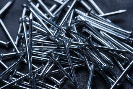 Nail pile, masonry nail, concrete nail background. macro photoの写真素材