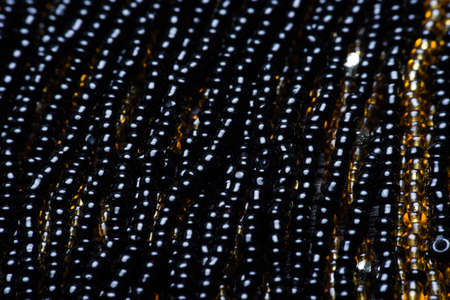 Black texture of beads. macro photo.の写真素材