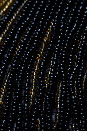 Black texture of beads. macro photo.の写真素材