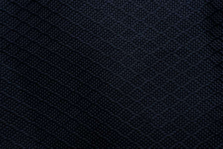 Black fabric texture background. Detail of canvas textile material.の写真素材