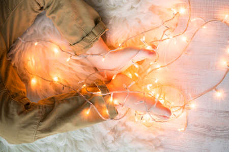 little boy playing with a garland. Merry Christmasの写真素材