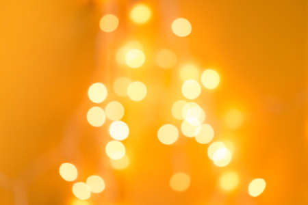 warm orange horizontal background with patches of garland, for desind and textの写真素材