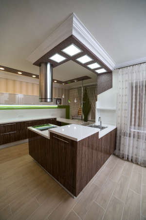 Modern kitchen interior with a high-polished countertop and sinkの写真素材