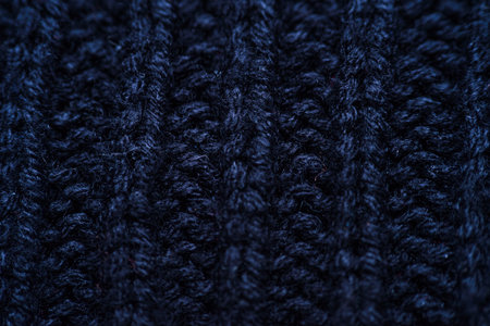 The texture of a knitted wool . Background