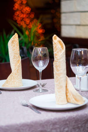 table in a restaurant. glasses and plates. restaurant interiorの写真素材