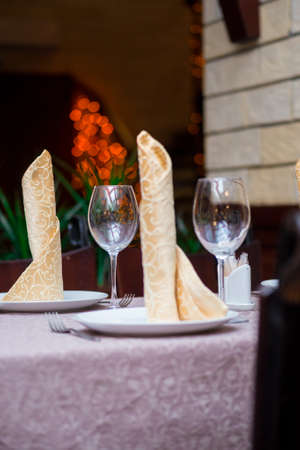 table in a restaurant. glasses and plates. restaurant interiorの写真素材