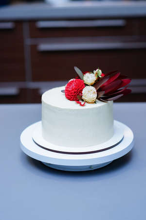 Decorated by flowers white naked cake, rustic style for weddings, birthdays and events.の写真素材