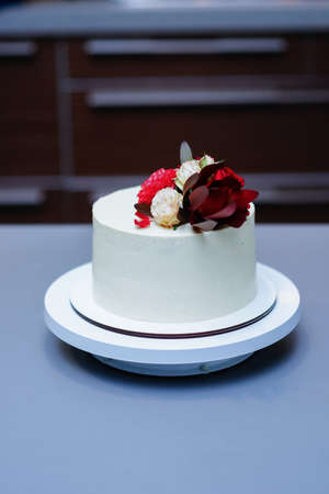 Decorated by flowers white naked cake, rustic style for weddings, birthdays and events.の写真素材