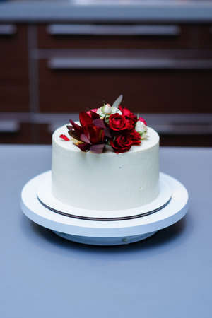 Decorated by flowers white naked cake, rustic style for weddings, birthdays and events.の写真素材