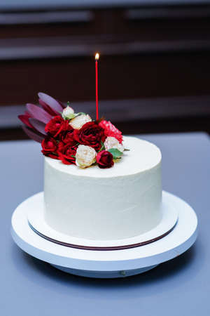 Decorated by flowers white naked cake, rustic style for weddings, birthdays and events.の写真素材