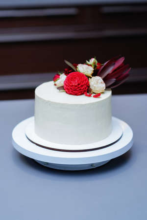 Decorated by flowers white naked cake, rustic style for weddings, birthdays and events.の写真素材