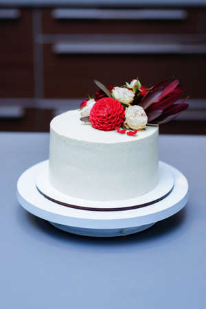 Decorated by flowers white naked cake, rustic style for weddings, birthdays and events.の写真素材