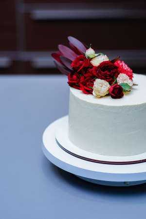 Decorated by flowers white naked cake, rustic style for weddings, birthdays and events.の写真素材
