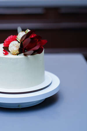 Decorated by flowers white naked cake, rustic style for weddings, birthdays and events.の写真素材