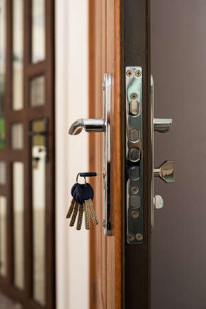 Strong lock with keys in the front door. home security, reliable robber protectionの写真素材