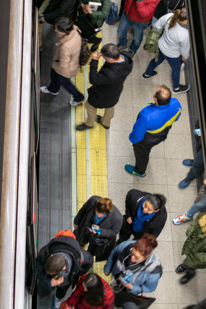 MADRID, SPAIN 07-12-2018 Madrid subway.  passengers on the platform boarding the train in Madrid...