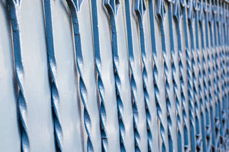 Blue iron fence. Decorative pattern. Texture and backgroundの写真素材