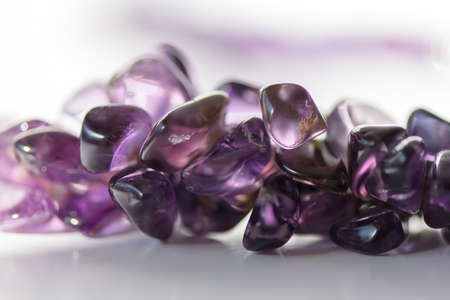 Amethyst crystals on white background. Purple gemstones.の写真素材