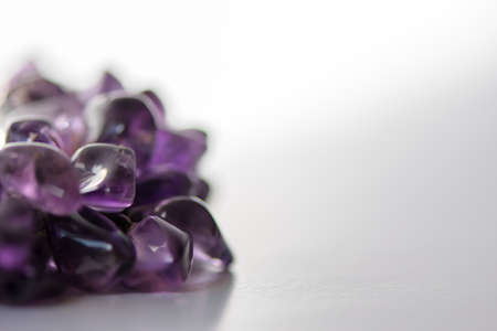 Amethyst crystals on white background. Purple gemstones.の写真素材
