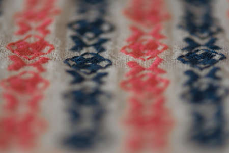 Embroidered pattern on cotton fabric. Fragment. Handmade.の写真素材