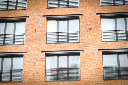 Modern red brick building exterior.