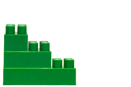 The meccano green color on a white background nobody. Figures from the meccano.の写真素材