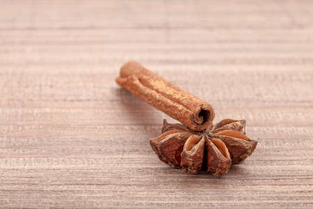 spicery cinnamon stick with an anisetree on a wooden table.の写真素材