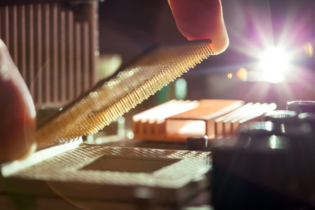 Technician plug in CPU microprocessor to motherboard socket, evident process of installation.