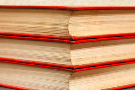 The old book firm cover with yellow pages, a side view close up.