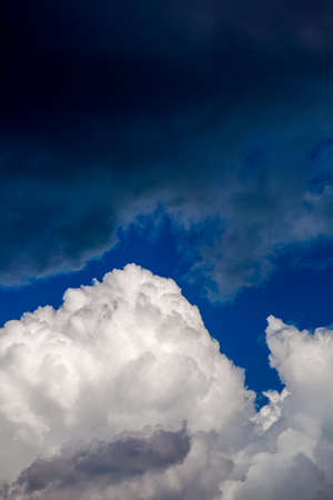 Storm clouds light and dark before a rain.の写真素材