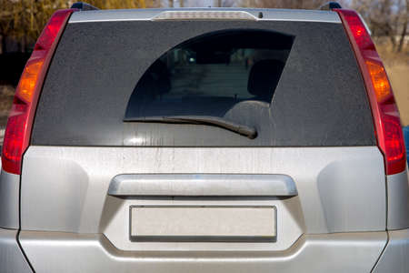 Dirty car view of glass of a rear view and boot lid.の写真素材
