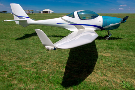 Small private plane at the airport in the field, sport propeller aircraft.