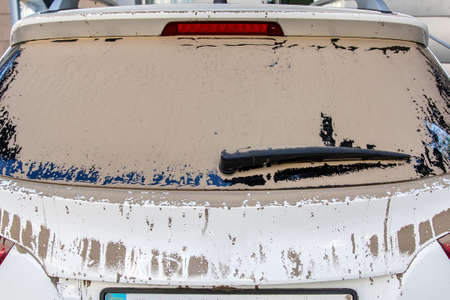 the dust windscreen of dirty car back view.の写真素材