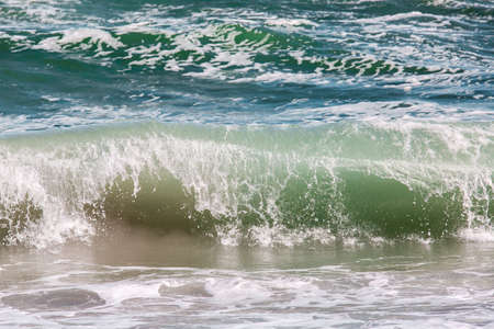The sea storm wave with splashes closeup, wonderful view of seascape, marine background.の写真素材