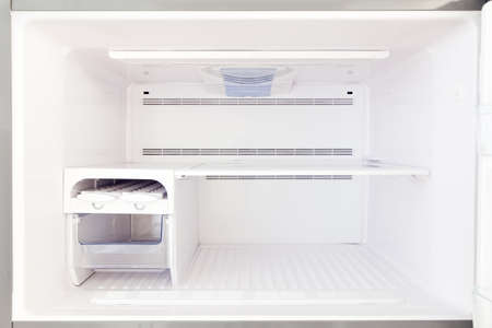 The freezer is a view inside the empty, freezer with empty shelves close-up.の写真素材
