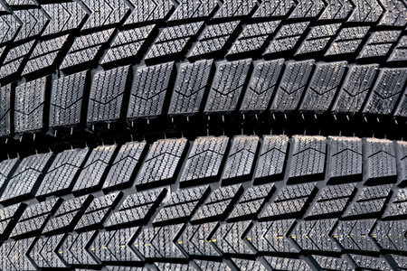 Protector of a winter car tire, closeup of a new tire for the winter season.