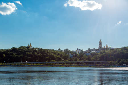KIEV, UKRAINE - June 4, 2018: cityscape of Kiev-Pechersk Lavra Ukrainian Orthodox Church of the Kiev Eparchy of  Moscow Patriarchate, view from the river of the Dnieper on the monastery in the tree.の写真素材