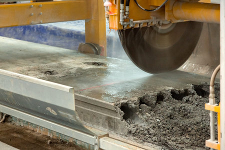Automated sawing machine for hollow core slabs, circular saw with water cooling cuts the concrete...