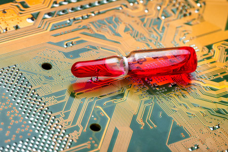Glass transparent ampoule with red liquid modern medicine using electronic methods and cyber printed...