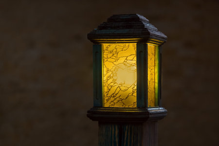 wooden street lamp with yellow glass diffuser, old light pole glow warm at evening closeup with copy...