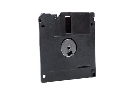 floppy diskette in a black square plastic case with open magnetic disk, obsolete computer technology...