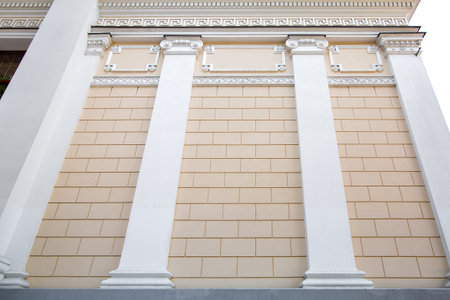 the beige facade of a historical building of cultural heritage with architectural design elements of...