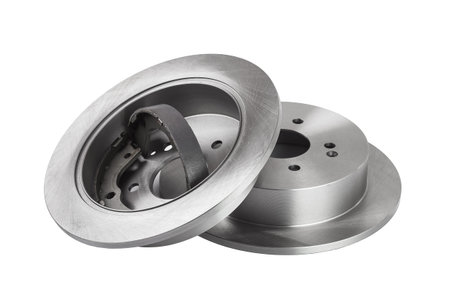 rear brake discs with drum brake pads inside a rotor, car spare parts side view isolated on white...