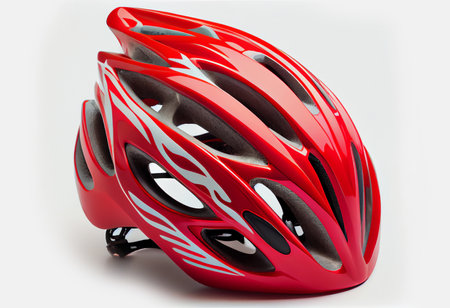 red helmet of a cyclist on a white background. ai generated.の素材