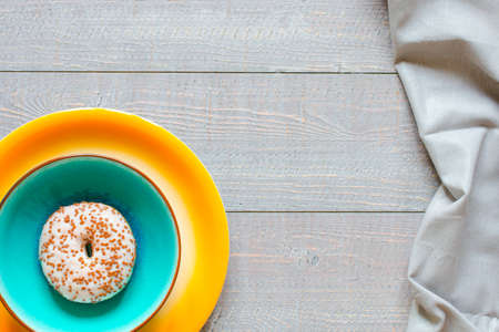 Morning breakfast with colorful Donuts on a rustic wooden background. Top viewの写真素材