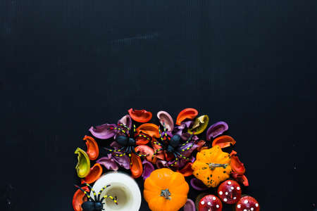 Halloween pumpkins, spiders and various objects on wooden backgroundの写真素材