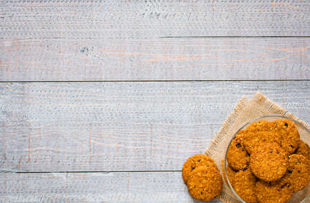 Healthy morning breakfast with cereal biscuits, over a wooden table background.の写真素材