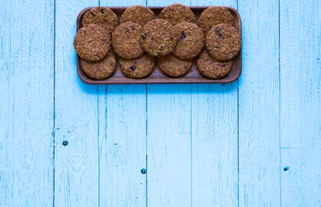 Healthy morning breakfast with cereal biscuits, over a wooden table background.の写真素材