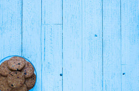 Healthy morning breakfast with cereal biscuits, over a wooden table background.の写真素材